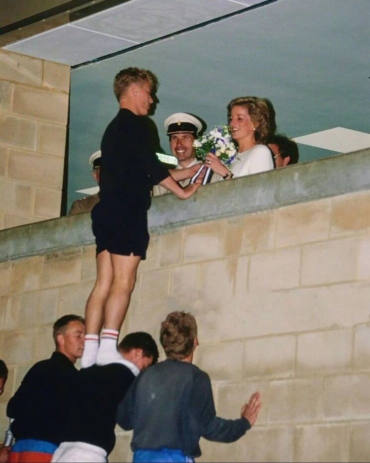boy giving flower to Princes Diana